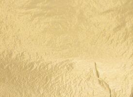 Golden foil surface with warm, soft glow. Vintage artistic design with subtle shimmer, reflecting photo