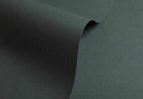 Paper texture with deep green tone, clean surface and folded wave finish, elegant forest green photo