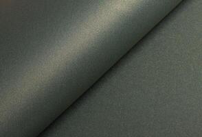 Paper texture with warm yellowish tone, glossy surface and pearlescent shimmer, stylish designer photo