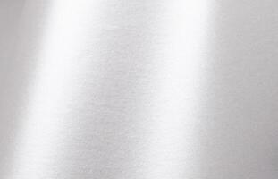 Silver paper texture with pearlescent gloss, shimmering surface and metallic platinum tones, sleek photo