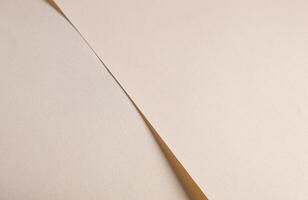 Soft beige paper texture with light gold and champagne tones, glossy finish with shimmering sparkle, photo
