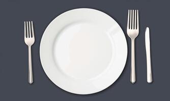 Plate and cutlery isolated on plain background in top view isolated photo