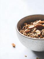 Granola with almonds and nuts in a bowl photo