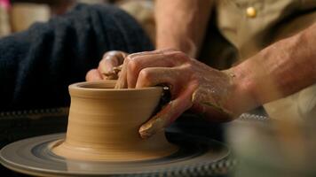 Man hands sculpting clay modeling professional male master potter pottery creating formed vase jug pot craftsman art handmade artisan skill craft earthenware ceramic product workshop clayware artwork photo