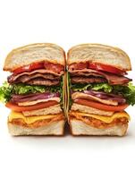 A sandwich cut in half with meat, cheese and vegetables photo