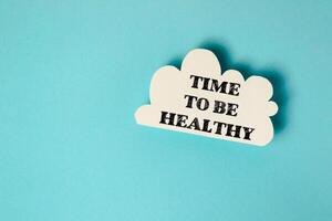 A cloud with the words Time to be healthy written on it photo