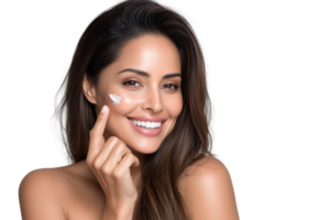 Smiling Hispanic woman showcases skincare routine with cream application against transparent backdrop in professional studio setting png