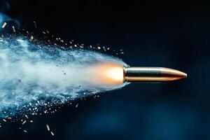 Bullet is shot out of a gun, leaving a trail of smoke and debris behind it photo