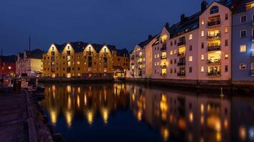 Time lapse clip of the old buildings next to the canal in Aalesund, Norway. Seen at night video