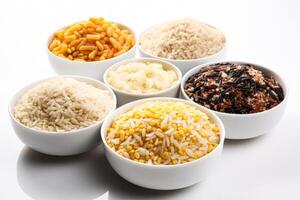 Assorted grains and legumes in small bowls on white background photo
