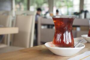 Refreshing cup of turkish tea served on a table photo