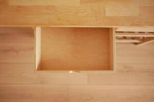 Minimalist design highlights empty wooden drawer at home photo
