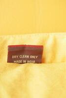 Fabric tag displaying care instructions and country of origin photo