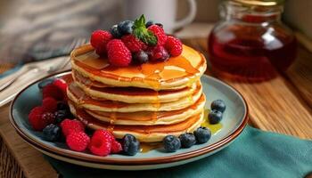 A delicious stack of fluffy pancakes topped with fresh raspberries, blueberries, and maple syrup on a plate. photo