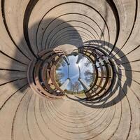 A view of a circular structure with a sky in the middle photo