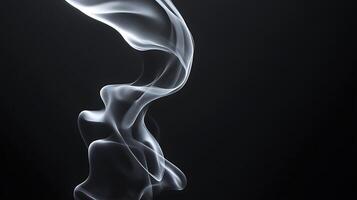 Elegant wisps of white smoke gracefully rising against a stark black background creating a serene atmosphere photo