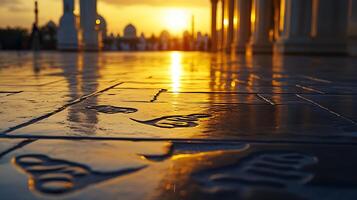 Sunset reflection on tiles at a mosque courtyard photo
