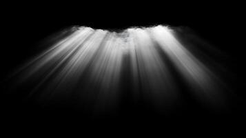 White light beams shining down from above against a dark black background creating a dramatic effect photo