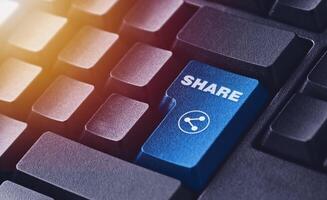 Share Button on Computer Keyboard. Digital Communication and Social Media Concept photo