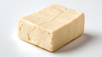 A block of butter on a white surface photo