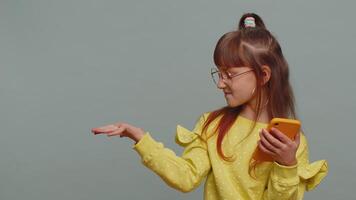 Girl using smartphone pointing empty place, positive feedback recommends social networks application video