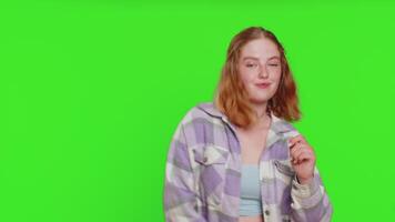 Happy woman having fun dancing, moving to rhythm, dabbing raising hands, making dub dance gesture video