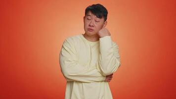 Man tired bored indifferent expression, exhausted of tedious story not interested in communication video