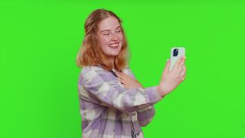 Happy woman blogger taking portrait selfie record call online with social media subscribers video