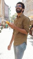Tourist traveler young man guy using looking smartphone search a way on map in mobile navigator app video