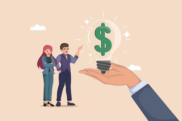 Monetizing Ideas Business Professionals Observing a Hand Presenting a Glowing Light Bulb Containing a Dollar Sign.