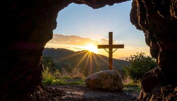 A wooden cross silhouette at a cave entrance, glowing in golden sunrise light. A serene, spiritual scene in nature ideal for Ascension Day, resurrection themes, and Christian reflection. photo