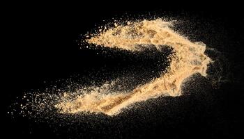 Fine golden sand dynamically thrown in the air against a solid black background. Captured with a high-speed effect, this abstract splash of dust particles explosion is perfect for use in design photo