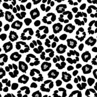 Black and white seamless leopard print pattern with small stylized flowers for modern backgrounds vector