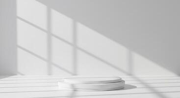 Empty white pedestal in a room with large windows photo