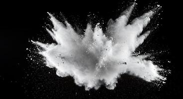 White powder exploding on a black background photo