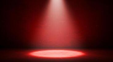 Red spotlight on a dark room with a red wall photo