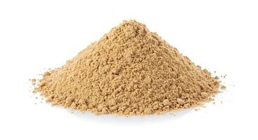 A pile of brown powder on a white background photo