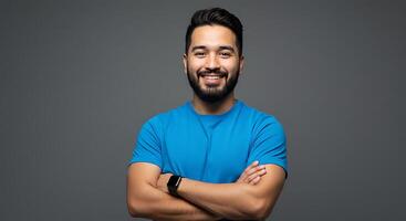 Portrait of a handsome young man with a beard and a blue shirt photo
