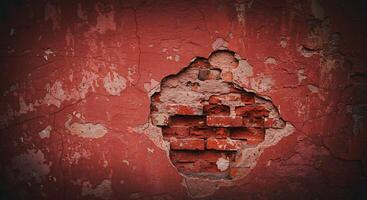 A hole in a wall with a brick in it photo