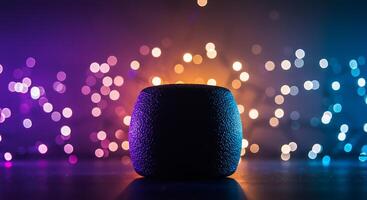 A speaker with colorful lights in the background photo