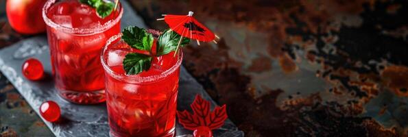 Civic Day Holiday Canada, alcoholic cocktails decorated with red maple leaf, mint and umbrella, dark background, horizontal banner, copy space, free space for text photo