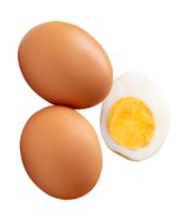 Three pieces of raw brown chicken eggs and cooked or boiled chicken egg with egg yolk in half isolated with clipping path in file format png