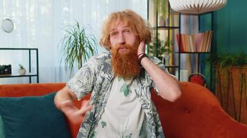 Confused Caucasian redhead man feeling embarrassed about ambiguous question, having doubts, no idea video
