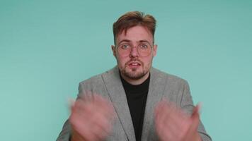 Man raising hands in indignant expression asking why what reason of failure demonstrating disbelief video