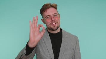 Business man looking approvingly, showing ok approve feedback like sign positive something good video