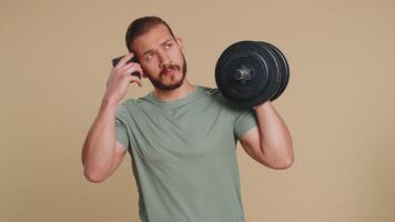 Athlete man use smartphone typing new post on web sms message browsing addiction of social networks video