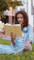 Preteen child girl relaxing interesting book turning pages smiling enjoying literature taking a rest video