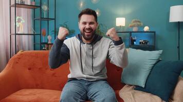 Excited happy young man surprised, shocked by sudden victory good win news celebrating wow reaction video