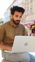 Happy indian man use laptop celebrating success, win message, playing game, lottery jackpot victory video