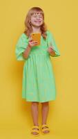 Child girl kid use mobile smartphone browsing say Wow yes found out great win good news celebrate video